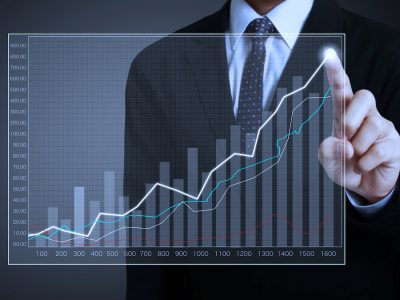 businessman with financial symbols coming from hand